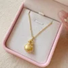 Golden Brushed Blessing Bag Pendant Necklace – Elegant Gold Jewelry