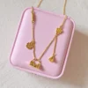 gold lock and flower pendant necklace by Lula Crystal