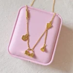 gold lock and flower pendant necklace by Lula Crystal